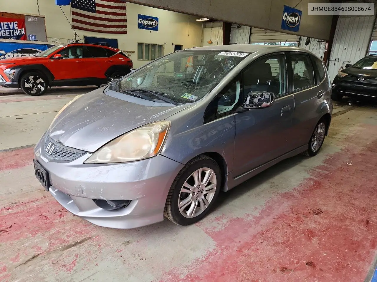 HONDA FIT 2009, VIN JHMGE88469S008674